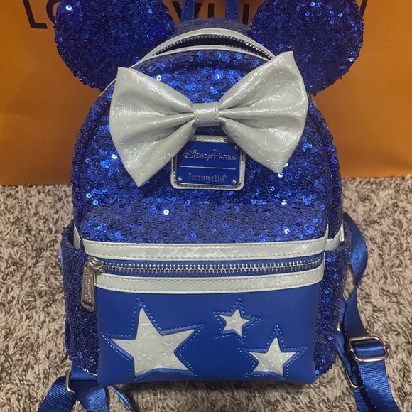 Loungefly Handbags - NWOT Disney Loungefly Make a Wish Blue Sequins mini backpack